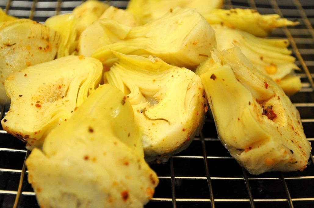 Artichoke hearts on smoker racks